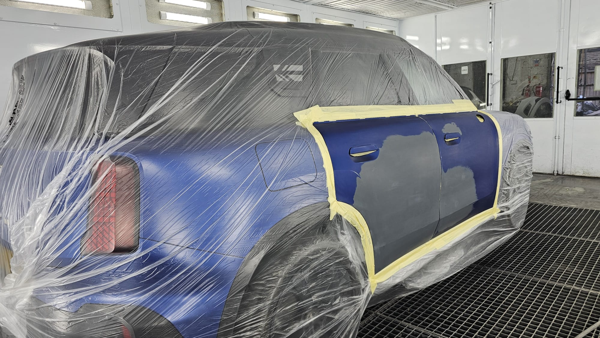 Vehicle panel masked and prepared in the Autophix paint booth