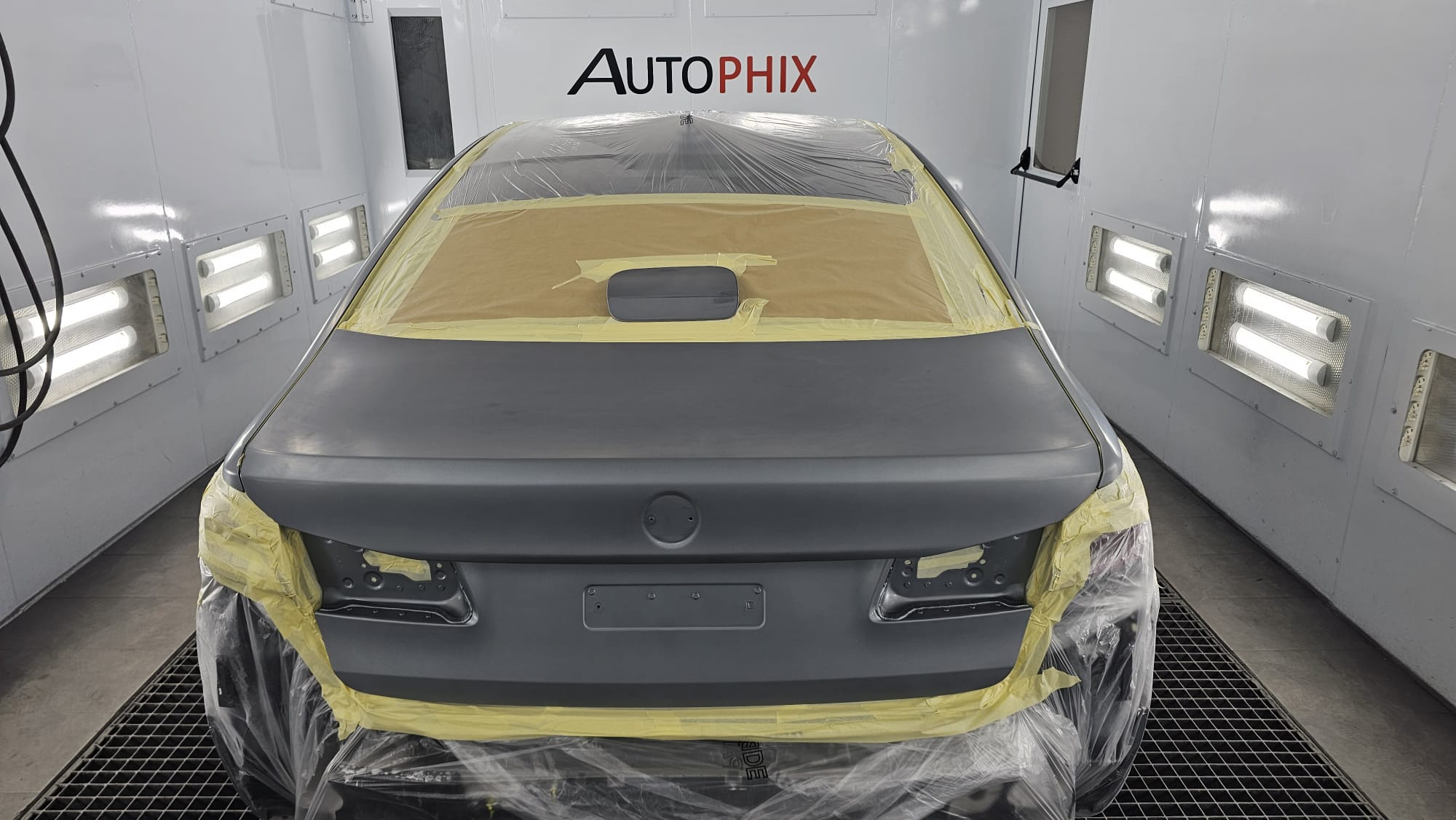 Mercedes-Benz masked and prepared for paint refinishing at Autophix