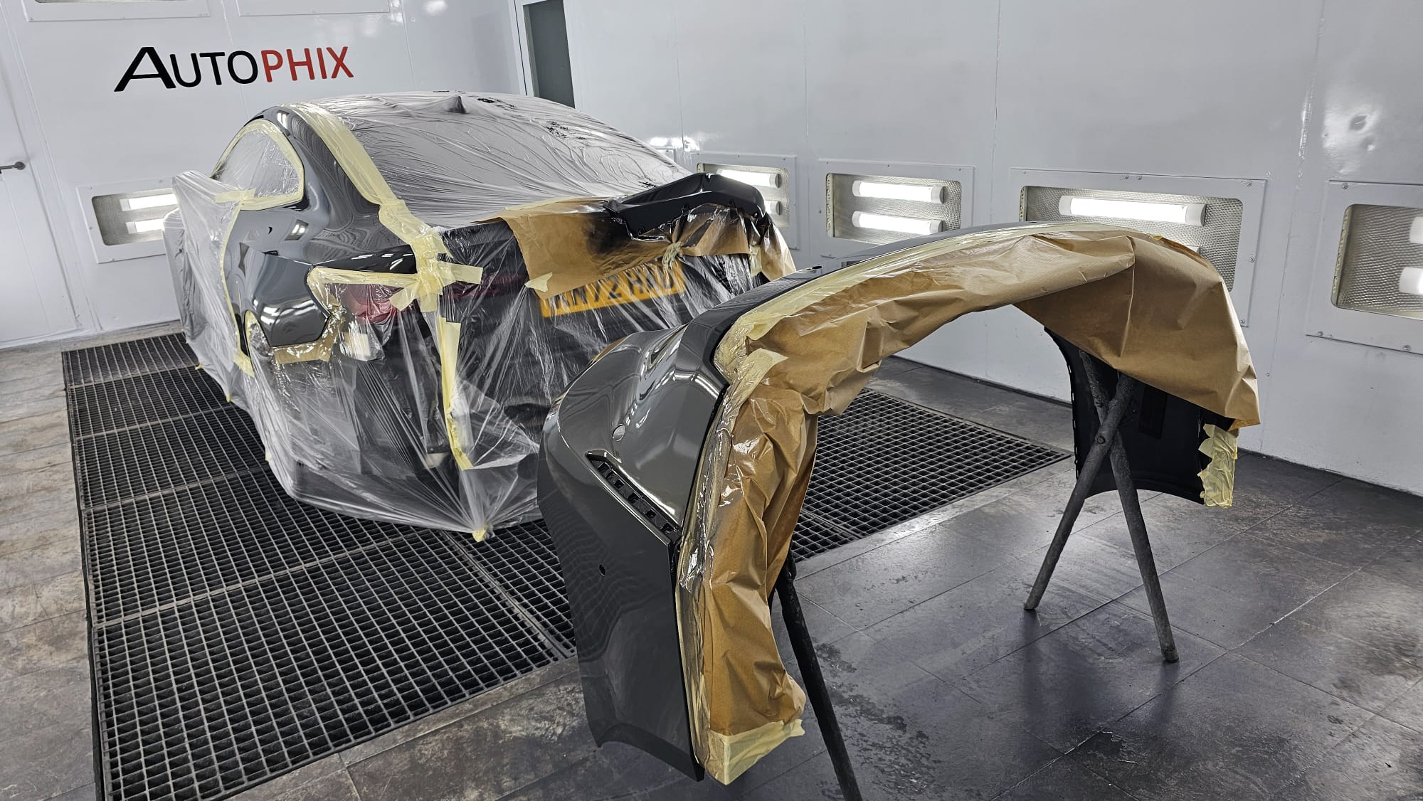 BMW M4 bumper prepared for controlled refinishing at Autophix