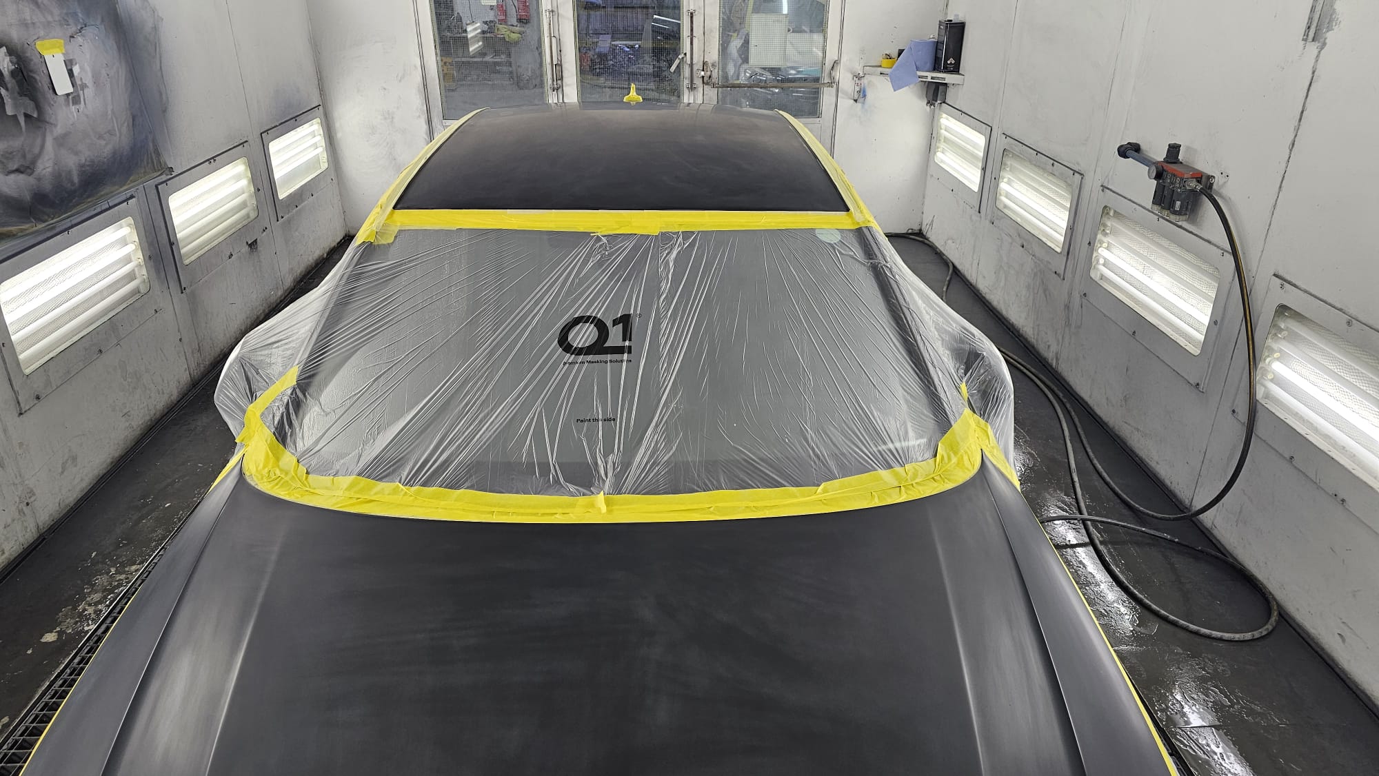Vehicle bonnet carefully prepared and masked before refinishing
